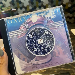 Menus can be scanned through a QR code that's pasted on a CD case! So cute