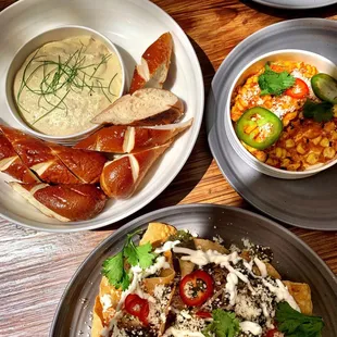 Bavarian pretzel + artichoke fondue  nachos elote