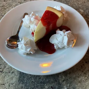Traditional Cheesecake with strawberry sauce