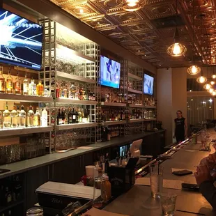 Really cool looking Bar! Classy and Modern. Plenty of TV's too!