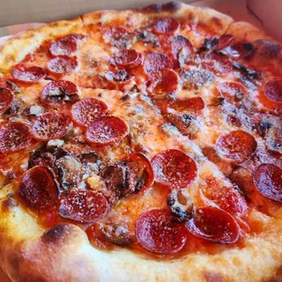 a pepperoni pizza in a box