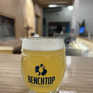 a glass of beer on a table