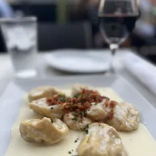 Butternut tortelloni with a sage butter cream sauce and bacon. Heaven.