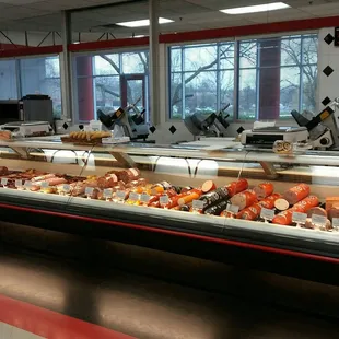 a deli counter with a variety of food items