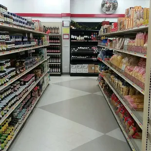 a grocery store aisle with a variety of products