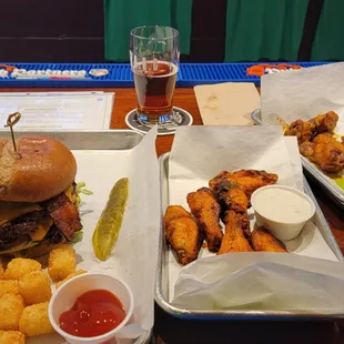 Burger with bacon avocado, the garden, and cheese, along with Buffalo and South Carolina BBQ sauce (half and half).