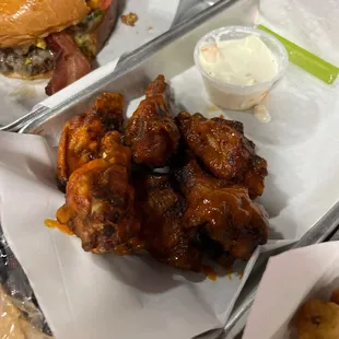 Smoked Wings and Smashburger in the background