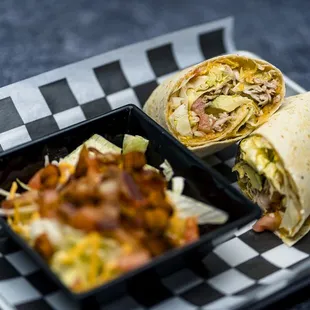 a burrito and a side dish