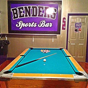 a pool table in a bar