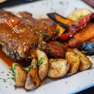 a plate of meat and vegetables