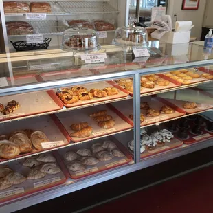 Pastries on display, late weekday afternoon.