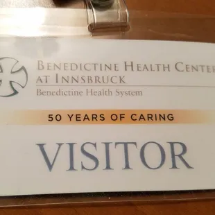 Get your visitor badge at the front desk