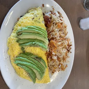 Veggie omelette with avocado added on top