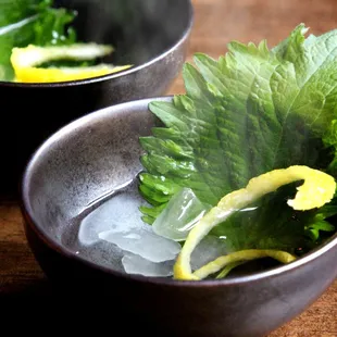 A Hundred Autumn Nights - Warm yuzu sake, shiso leaf, lemon peel, rock sugar