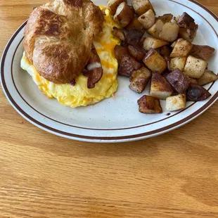 Breakfast croissant and home fries