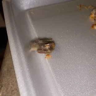 a piece of food left on a cutting board
