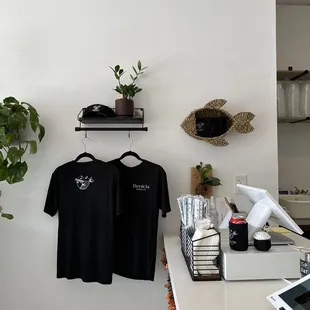 a t - shirt hanging on a wall