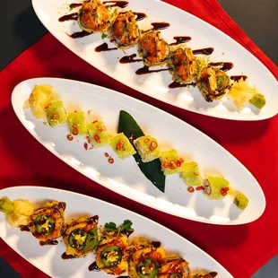 three plates of food on a red place mat