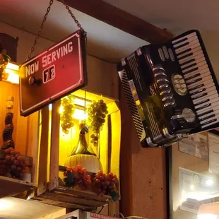 a sign hanging from the ceiling of a restaurant