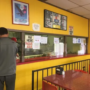 a man standing in front of the counter