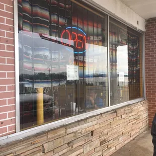 open sign in window of restaurant