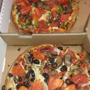 two pizzas in boxes