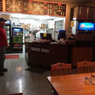 a man standing in a restaurant