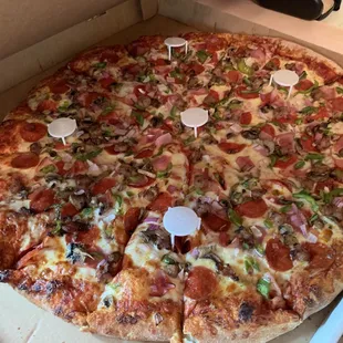 Big Benito with pepperoni, ham, Italian sausage, green pepper, and onions.