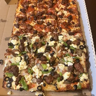 Half meat lovers half 9 toppings with meats, onions,peppers,black olives and ricotta cheese. Incredible.