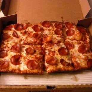 a pepperoni pizza in a box
