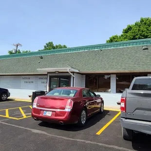 two cars parked in a parking lot