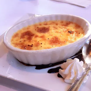 a dish of creme with whipped cream