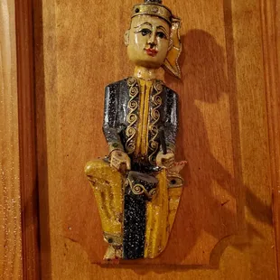 a statue of a man sitting on a chair