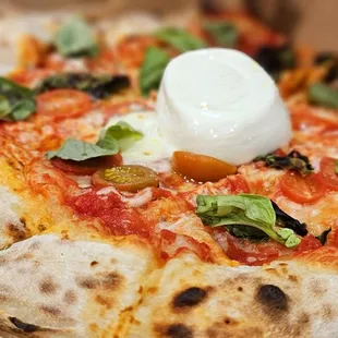 His Margherita Pizza with Burrata in the middle