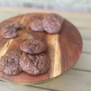 chocolate cookies on a wooden plate