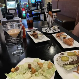 Caesar salad, Black &amp; Blue burger no bun, yummy hand cut fries, Reuben rolls, steak bites, walleye fingers, Carrot Cake martini