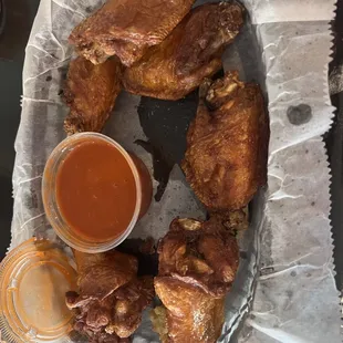 Bone in wings with buffalo sauce on the side