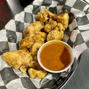 Teriyaki boneless wings with side of Hot wing sauce
