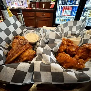 PBJ wings on the left and spicy garlic to the right with a special bleu cheese sauce. Delicious!