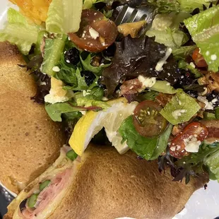 Ham, cheese, and asparagus crepe with salad.