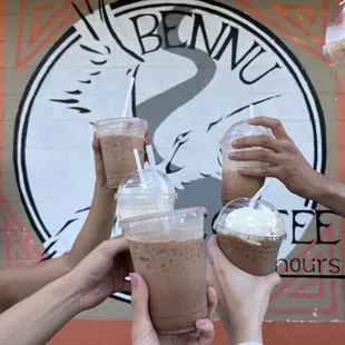 a group of people raising their drinks