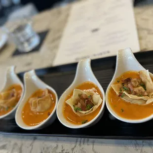 Grilled cheese dumplings in tomato bisque