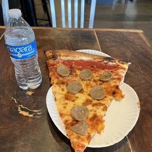 HUGE Slice of sausage pie and a bottle of water (duh)..
