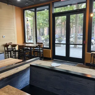 an empty restaurant with tables and chairs