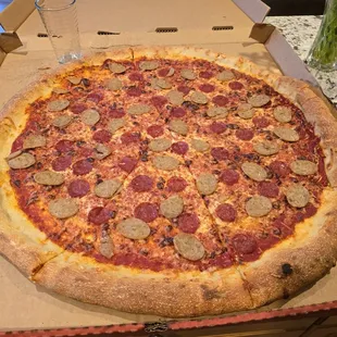 Pepperoni and sausage pizza. LARGE. Like, VERY LARGE.