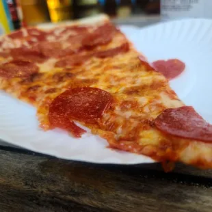 a slice of pepperoni pizza