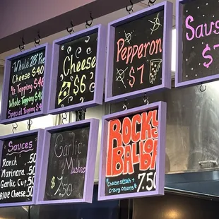 a variety of menus on a wall