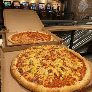 Below: pineapple, banana pepper, sweet red peppers Top: half cheese half pepperoni