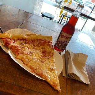 Huge slice and grape soda