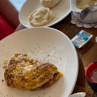 Meat lovers omelette w/grits &amp; biscuit.